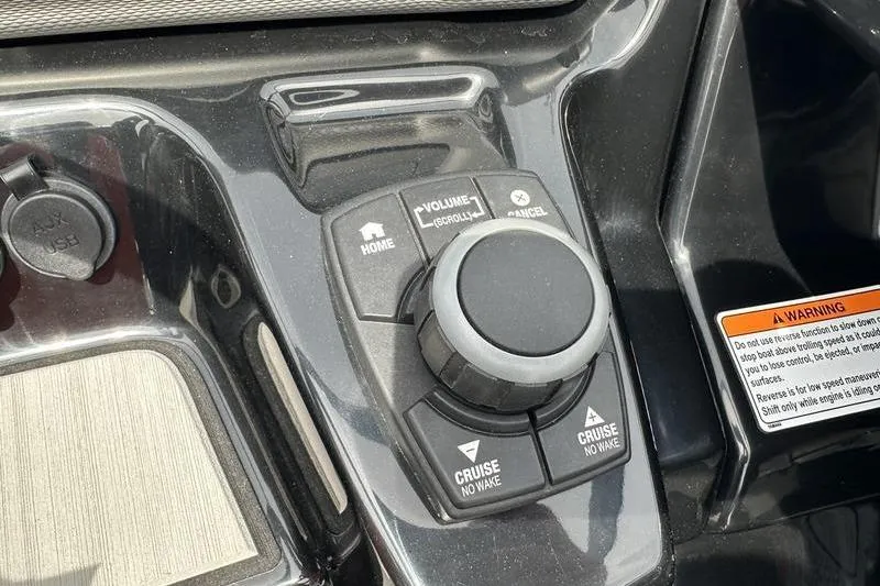 Slide: The Image of Control panel of 2020 Yamaha Boats SX240 featuring cruise and volume controls. - 21