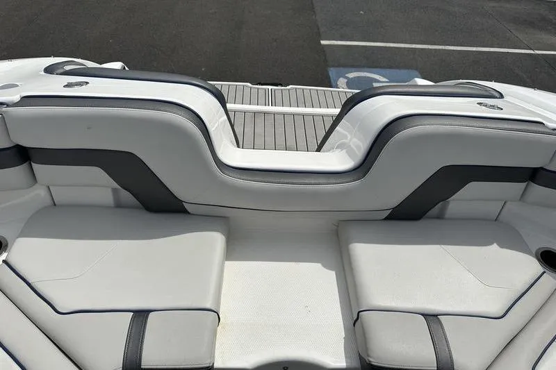 Slide: The Image of 2020 Yamaha Boats SX240 interior seating with sleek white and gray upholstery. - 22