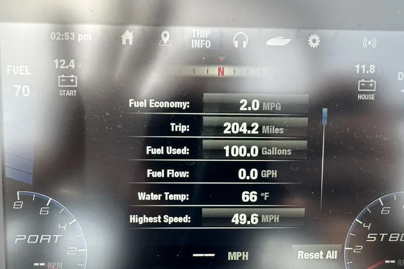 Slide: The Image of Dashboard display of 2020 Yamaha Boats SX240 showing trip info and fuel economy. - 27