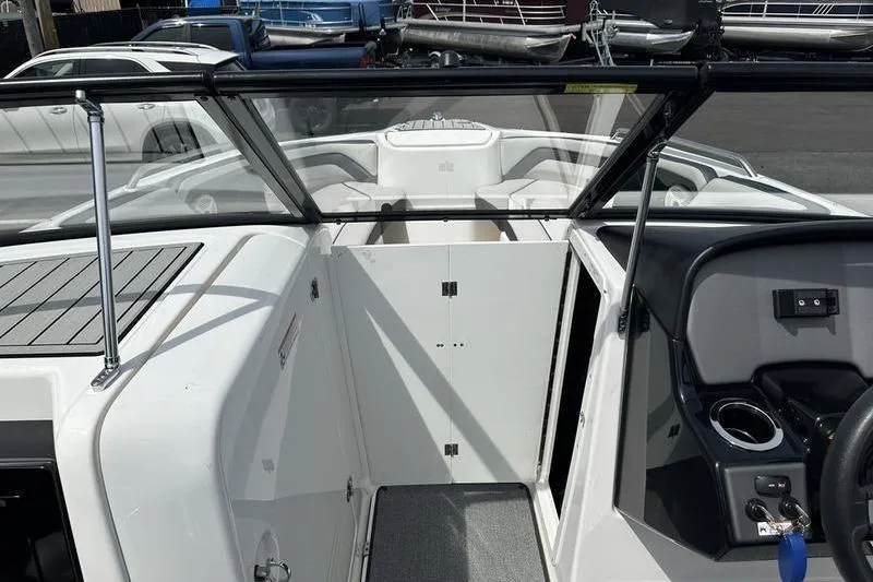 Slide: The Image of 2020 Yamaha Boats SX240 interior view with windshield and control panel. - 32
