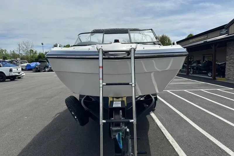 Slide: The Image of 2020 Yamaha Boats SX240 on trailer in parking lot, front view. - 4