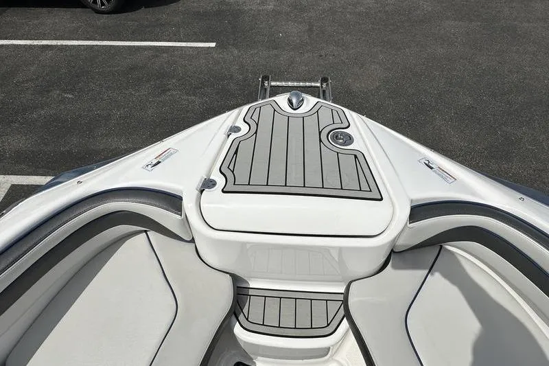 Slide: The Image of 2020 Yamaha Boats SX240 bow area with sleek seating and deck design. - 46