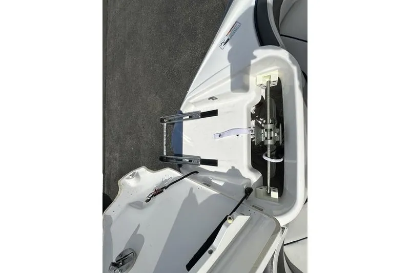 Slide: The Image of 2020 Yamaha Boats SX240 anchor compartment with ladder, open on deck. - 49