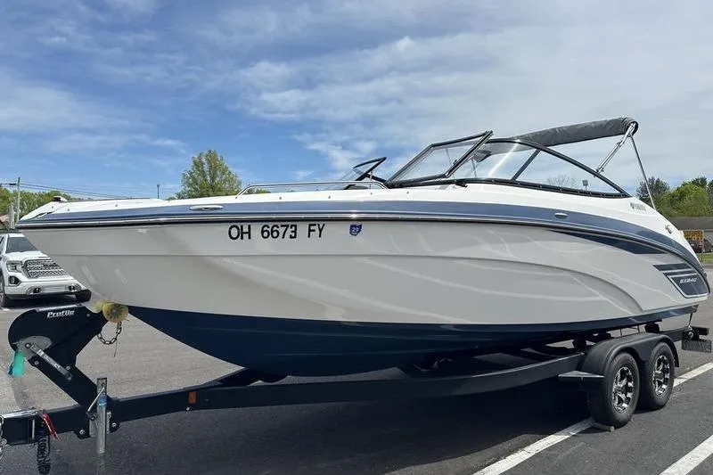 Slide: The Image of 2020 Yamaha Boats SX240 on trailer, parked outdoors under a clear sky. - 8