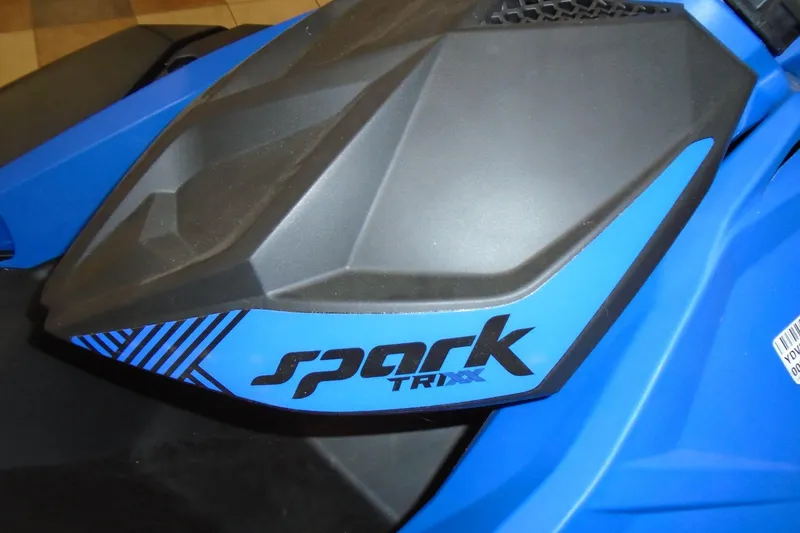 Slide: The Image of 2023 Sea-Doo Spark Trixx 3up in blue, showcasing sleek design and branding. - 2