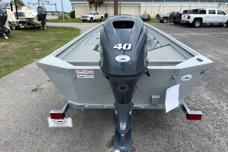 Slide: The Image of 2026 SeaArk DXS 1652 DKLD boat with a 40 HP outboard motor on a trailer. - 3