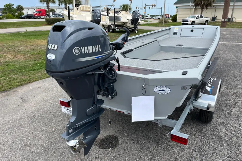 Slide: The Image of 2026 SeaArk DXS 1652 DKLD boat with Yamaha 40 outboard motor on trailer. - 4