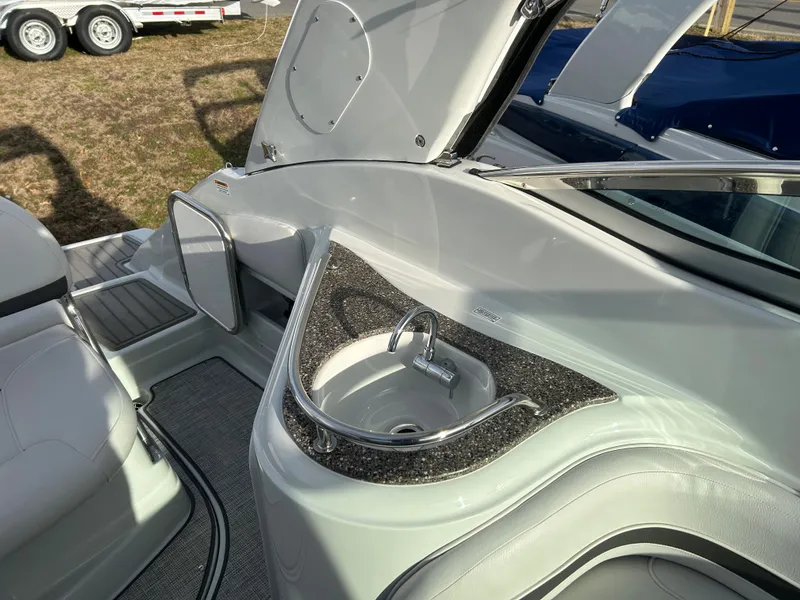 Slide: The Image of Interior of 2023 Crownline 270 CR with sink and seating area. - 7