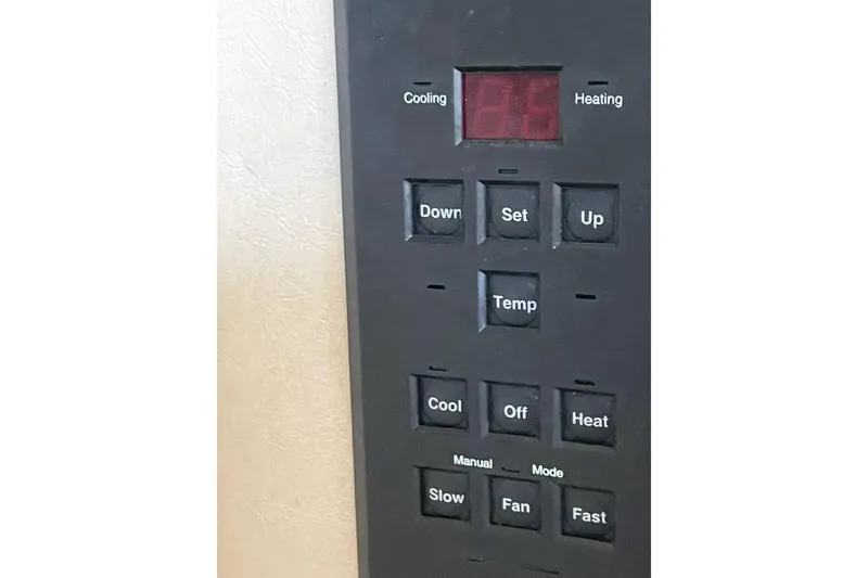 Slide: The Image of Control panel of a 2000 Sea Ray 290 Sundancer boat, featuring temperature and mode settings. - 6