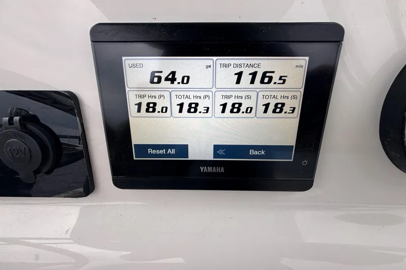 Slide: The Image of Yamaha display on 2025 Key West 244 Center Console showing fuel and trip data. - 3