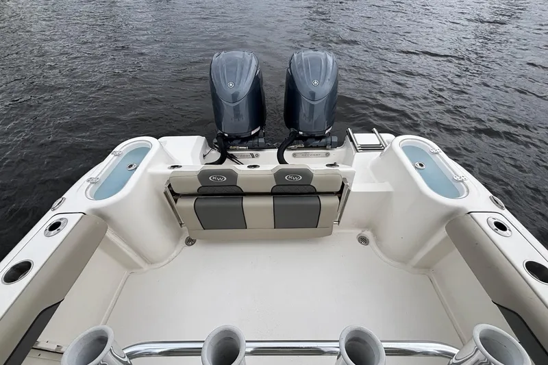 Slide: The Image of 2025 Key West 244 Center Console boat with dual engines on water. - 5