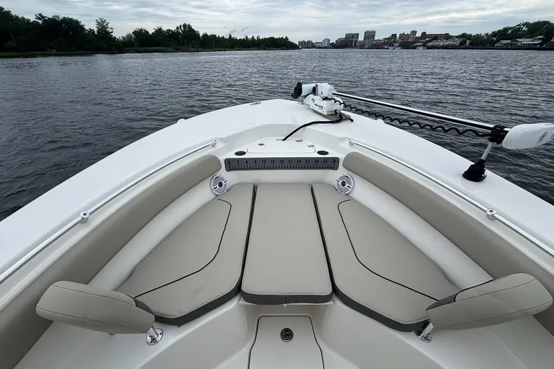 Slide: The Image of 2025 Key West 244 Center Console boat interior with seating and water view. - 9