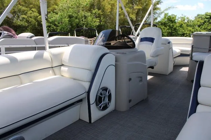 Slide: The Image of Luxurious 2015 South Bay 524E pontoon boat interior with plush seating and modern design. - 11