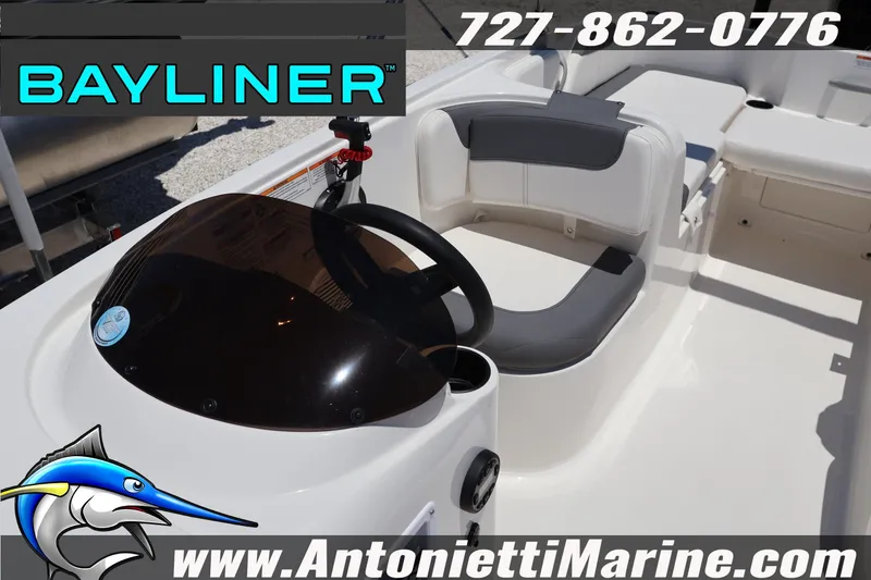 Slide: The Image of 2026 Bayliner Element E18 boat interior with steering wheel and seating, Antonietti Marine branding. - 13
