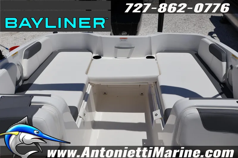 Slide: The Image of 2026 Bayliner Element E18 boat interior with seating, cup holders, and branding details. - 19