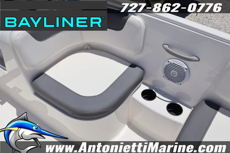 Slide: The Image of 2026 Bayliner Element E18 boat interior with seating, speaker, and cup holders. - 20