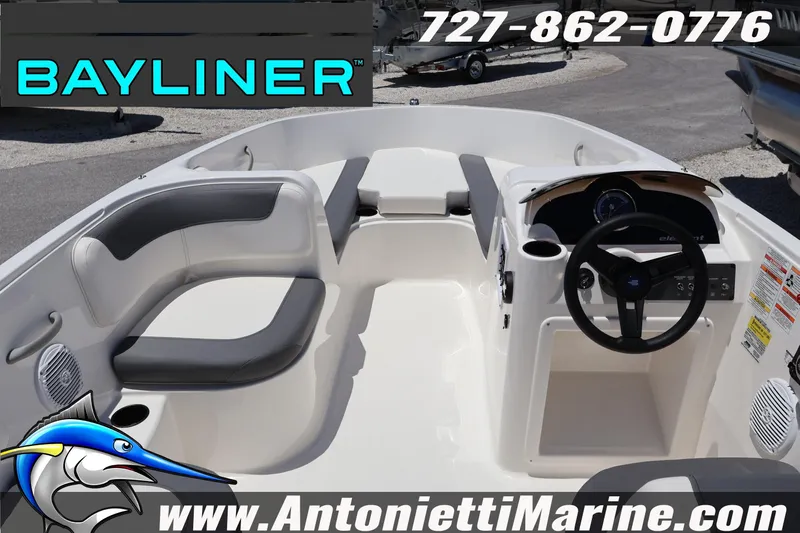 Slide: The Image of 2026 Bayliner Element E18 boat interior with seating and steering wheel, displayed at Antonietti Marine. - 21