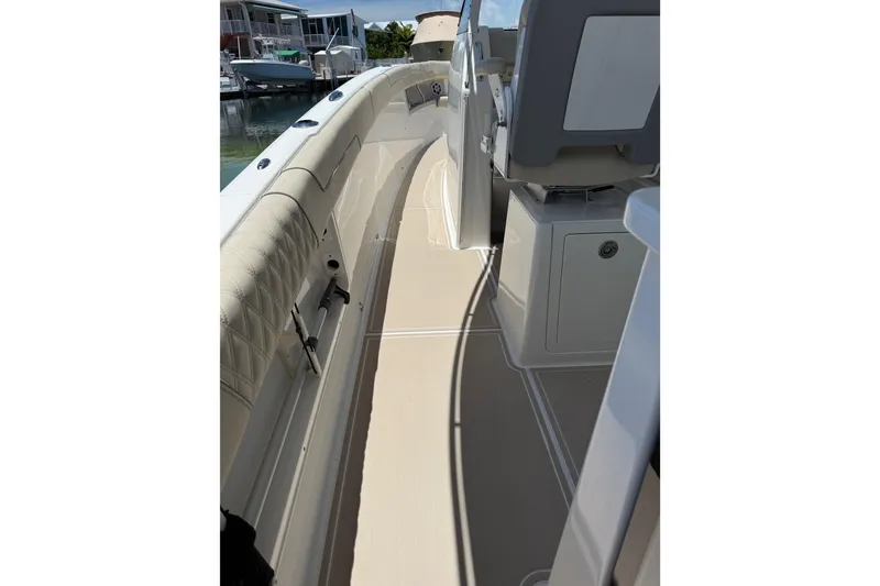 Slide: The Image of 2022 Regal 38 SAV boat interior with sleek seating and modern design. - 40