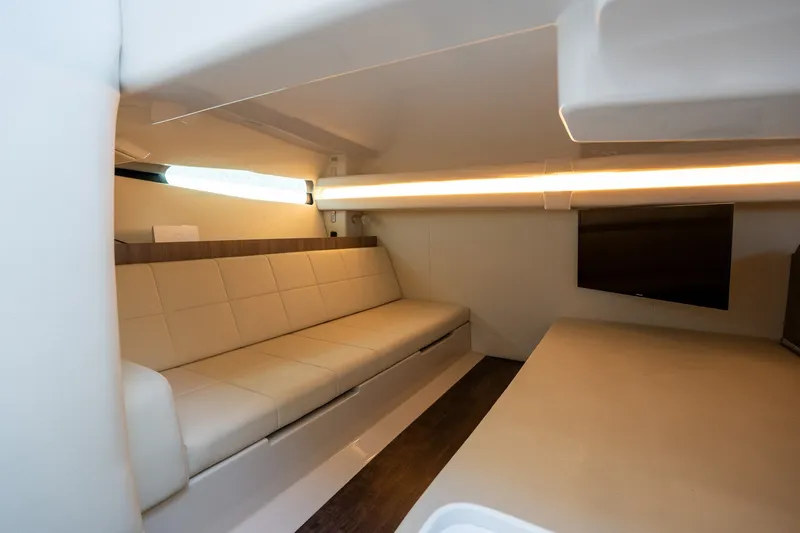 Slide: The Image of Luxurious interior of 2022 Regal 38 SAV yacht with modern seating and ambient lighting. - 52