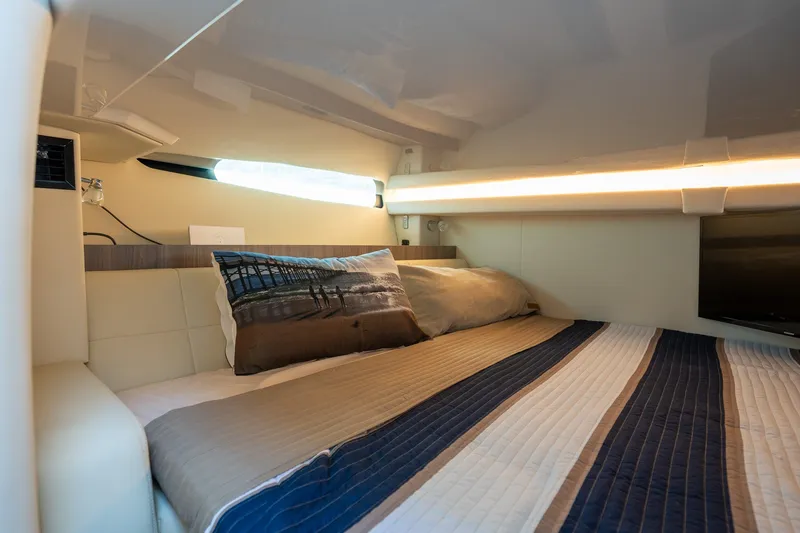 Slide: The Image of Luxurious cabin interior of 2022 Regal 38 SAV yacht with cozy bedding. - 46