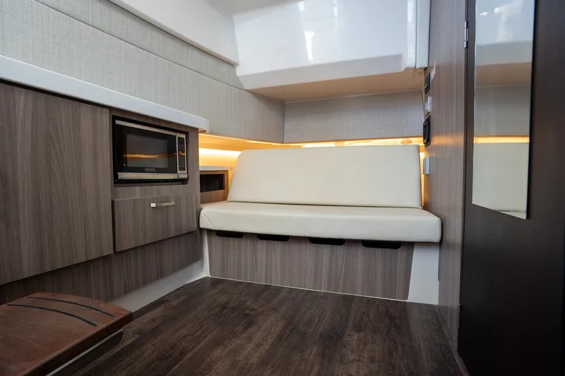 Slide: The Image of Interior of 2022 Regal 38 SAV boat with modern seating and kitchenette. - 45