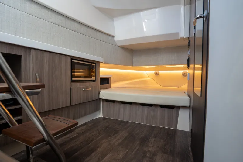 Slide: The Image of 2022 Regal 38 SAV cabin interior with modern wood finish and ambient lighting. - 44