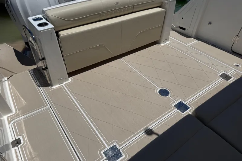 Slide: The Image of 2022 Regal 38 SAV boat deck with beige seating and patterned flooring. - 43