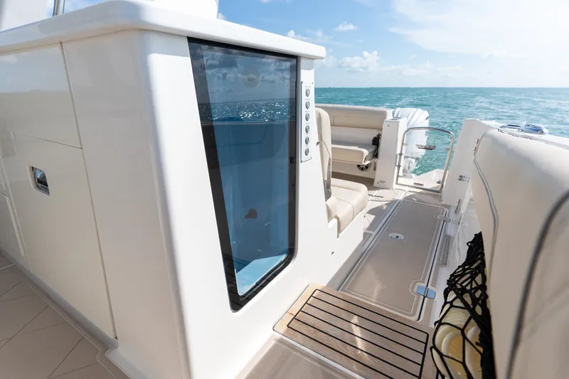 Slide: The Image of 2022 Regal 38 SAV boat interior with seating and ocean view. - 26