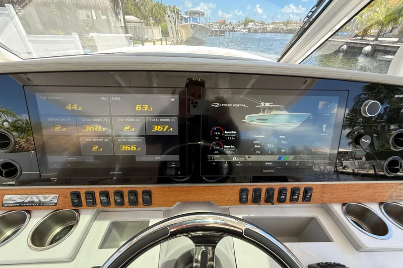 Slide: The Image of 2022 Regal 38 SAV dashboard with digital displays and navigation controls. - 6