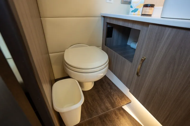 Slide: The Image of Modern bathroom in 2022 Regal 38 SAV yacht with wood accents and compact design. - 49
