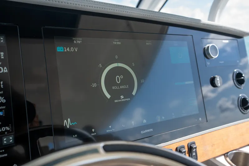 Slide: The Image of Garmin display on 2022 Regal 38 SAV boat showing roll angle and voltage. - 41