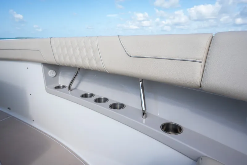 Slide: The Image of Luxury seating and cup holders on 2022 Regal 38 SAV boat deck. - 31