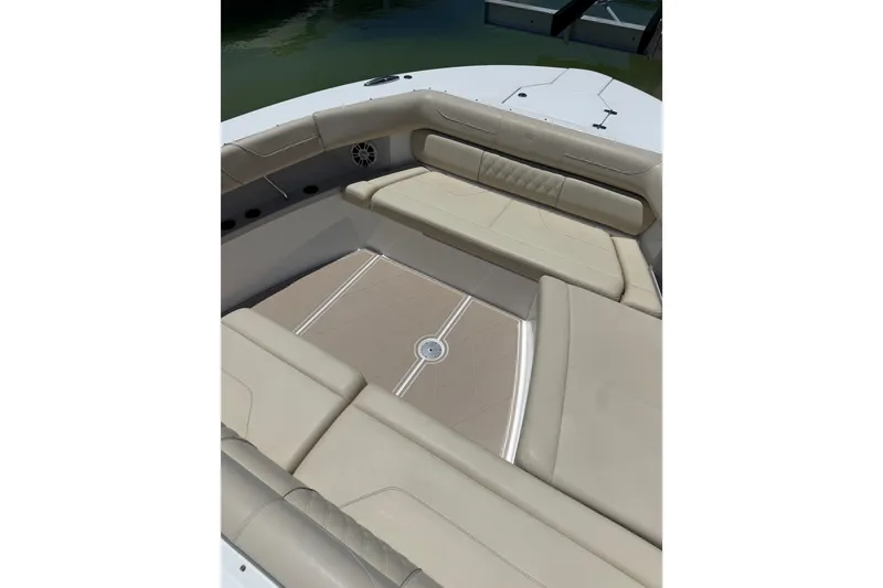Slide: The Image of Luxurious seating area on 2022 Regal 38 SAV boat with beige upholstery. - 42