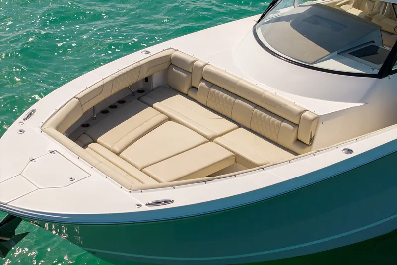 Slide: The Image of 2022 Regal 38 SAV boat with luxurious seating on turquoise water. - 4