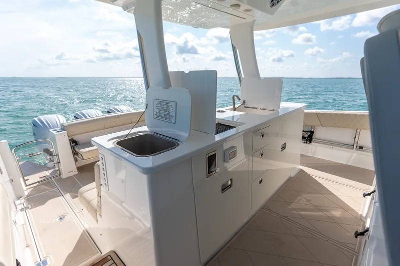 Slide: The Image of Luxurious 2022 Regal 38 SAV yacht interior with sleek kitchen and ocean view. - 23