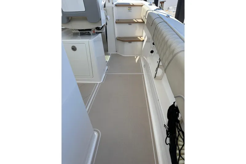 Slide: The Image of 2022 Regal 38 SAV boat interior with seating and steps, showcasing modern design. - 41