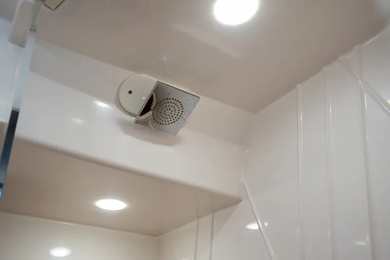 Slide: The Image of Ceiling view of 2022 Regal 38 SAV with modern lighting and speaker system. - 48