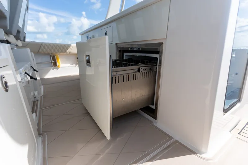 Slide: The Image of Open drawer on 2022 Regal 38 SAV yacht, showcasing onboard storage. - 27