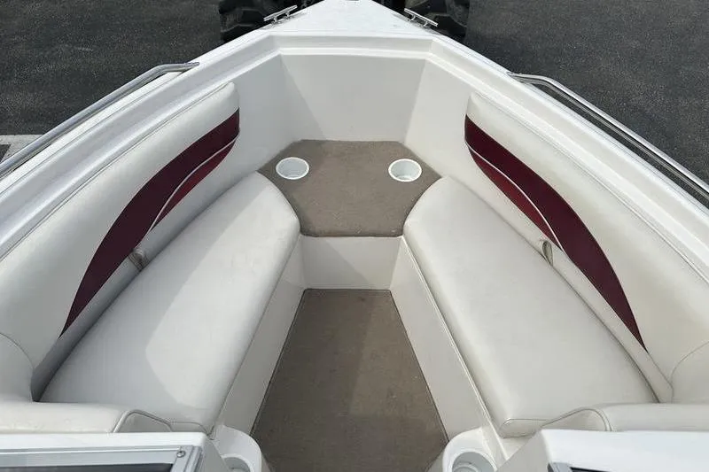 Slide: The Image of Interior of 2000 Ebbtide Campione 182 boat with white and maroon seating. - 13