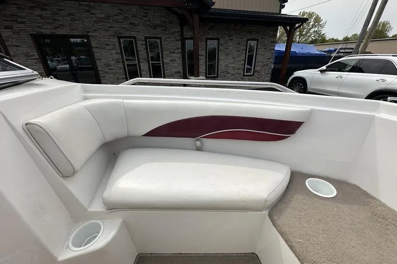 Slide: The Image of Interior seating of a 2000 Ebbtide Campione 182 boat with white upholstery. - 3