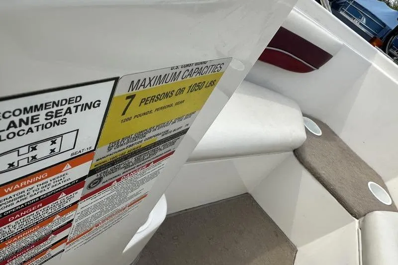 Slide: The Image of 2000 Ebbtide Campione 182 boat capacity label, seating for 7 persons or 1050 lbs. - 8