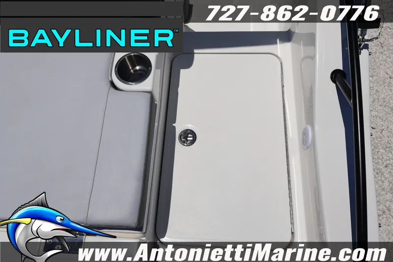 Slide: The Image of Bayliner D20 2026 boat interior with cup holder and storage compartment. - 14