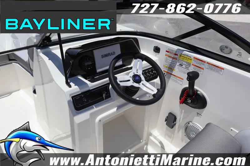 Slide: The Image of 2026 Bayliner D20 boat dashboard with steering wheel and controls, featuring Simrad display. - 19