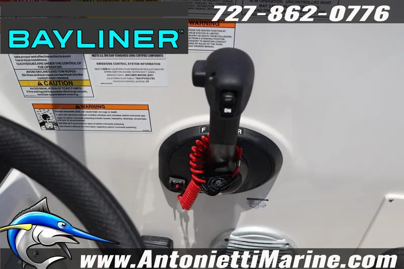 Slide: The Image of Bayliner D20 2026 boat control panel with throttle lever and safety warnings. - 23