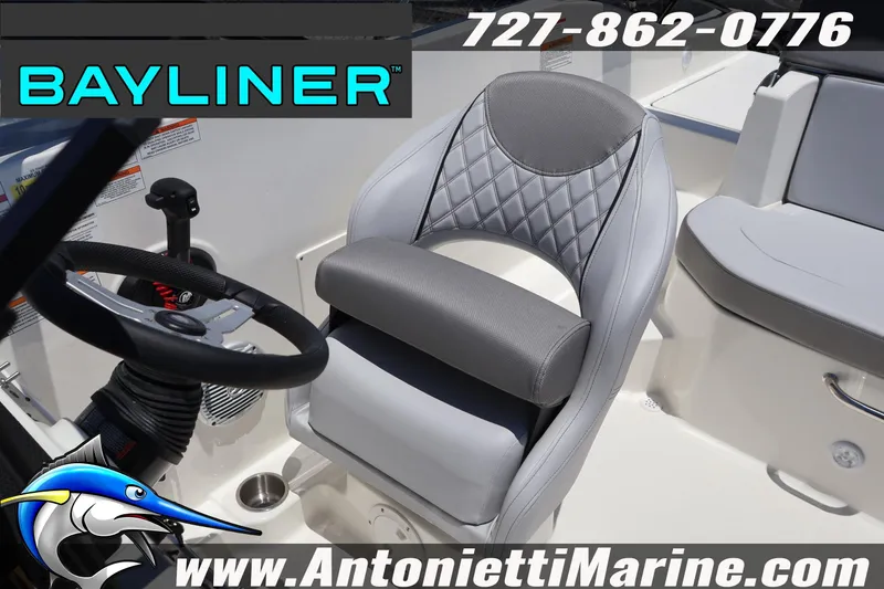 Slide: The Image of 2026 Bayliner D20 boat interior with steering wheel and cushioned seat. - 30