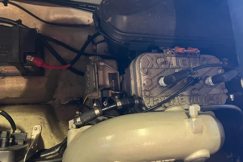 Slide: The Image of 2001 Sea-Doo GTI engine compartment showing battery and mechanical components. - 9