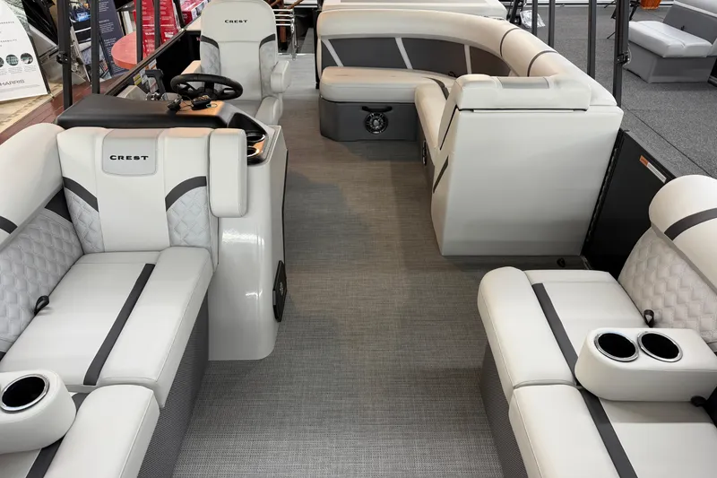 Slide: The Image of Interior of 2025 Crest Classic 200 pontoon boat with luxurious seating and modern design. - 2