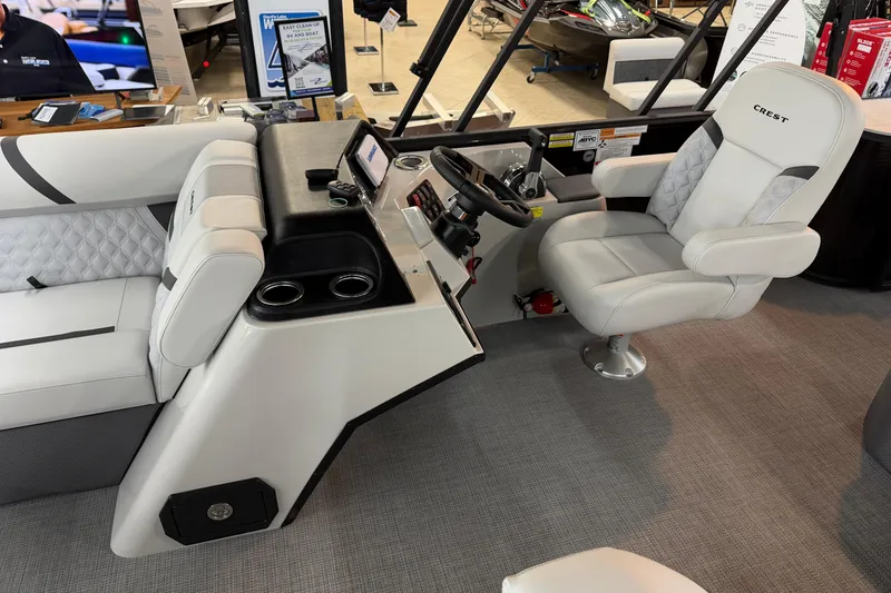 Slide: The Image of Interior of 2025 Crest Classic 200 boat with modern helm and comfortable seating. - 5