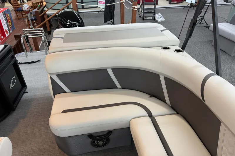 Slide: The Image of Luxurious seating on 2025 Crest Classic 200 pontoon boat, featuring sleek design and cup holders. - 9