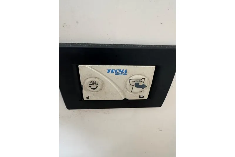 Slide: The Image of Control panel for Tecma Thetford toilet on 2015 Hurricane SunDeck 2400 OB boat. - 16